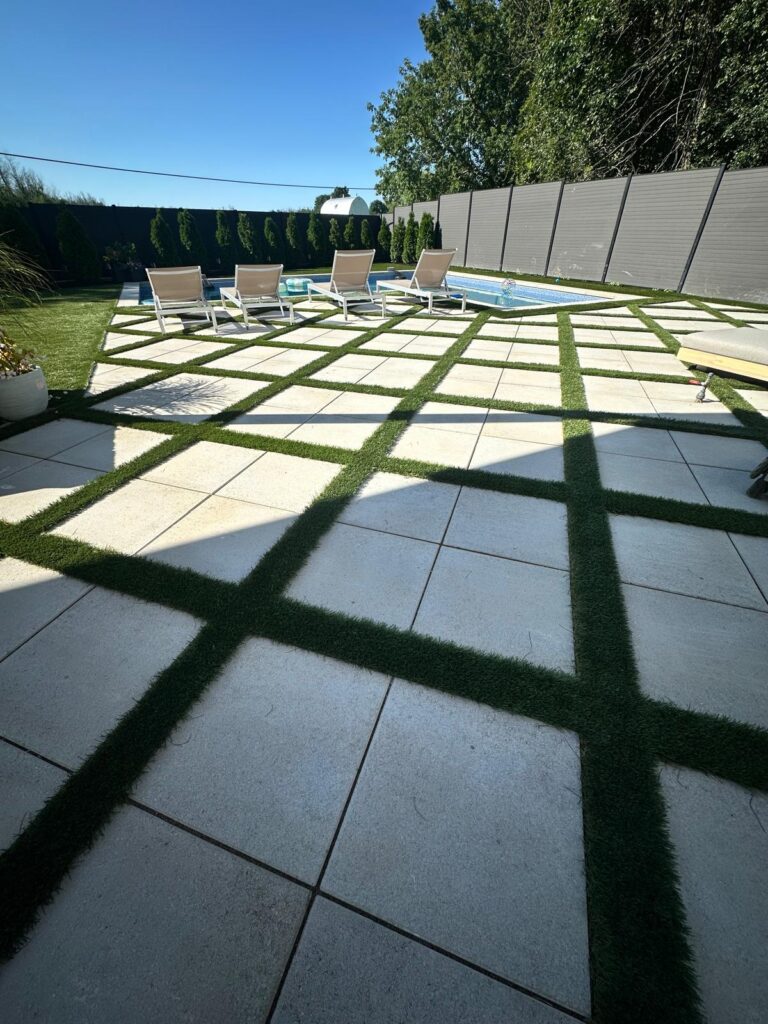 backyard makeover with stone and artificial turf